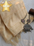 Beige scarf with jewelry on a light background, featuring a 'NEW' label.