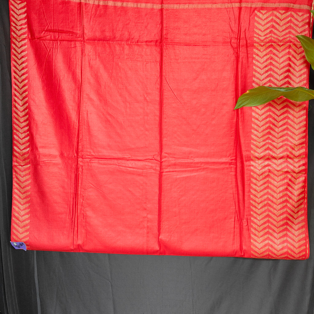 Red fabric with a chevron pattern on a gray background