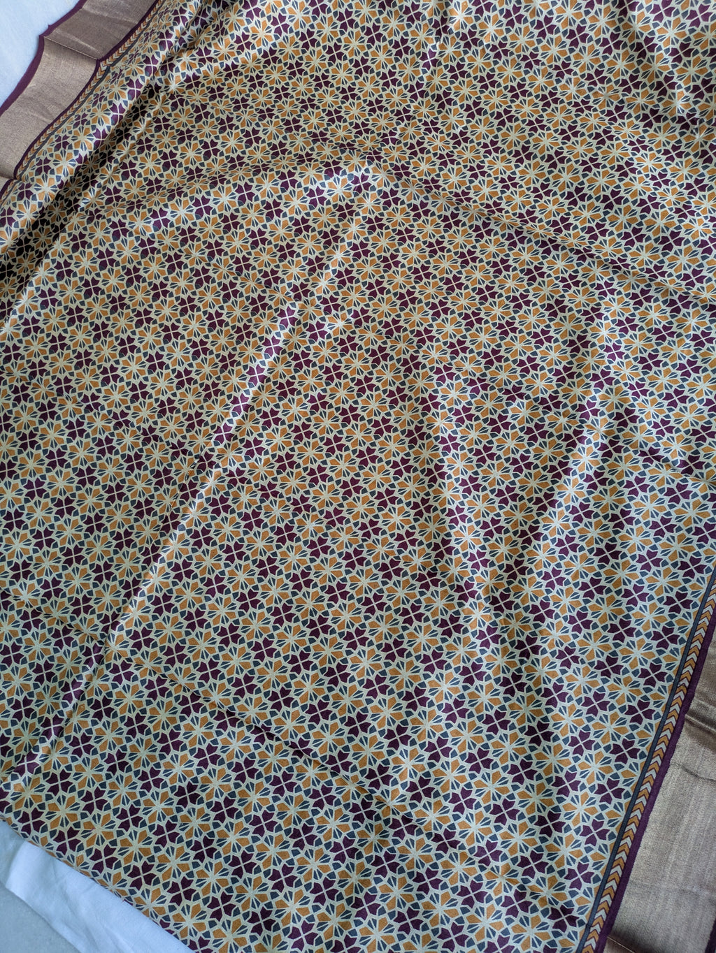 Patterned fabric with a floral design on a plain background