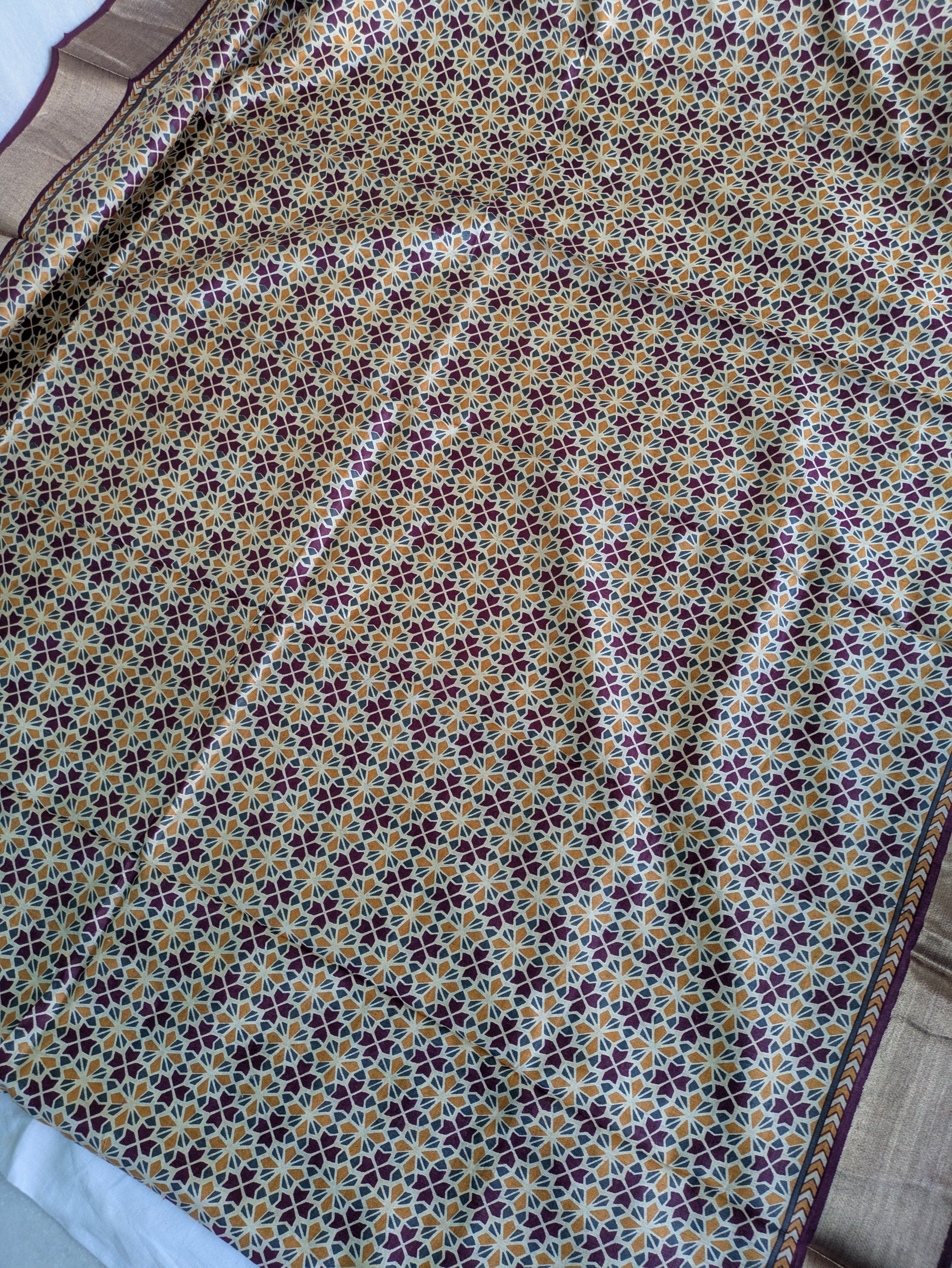 Patterned fabric with a floral design on a plain background