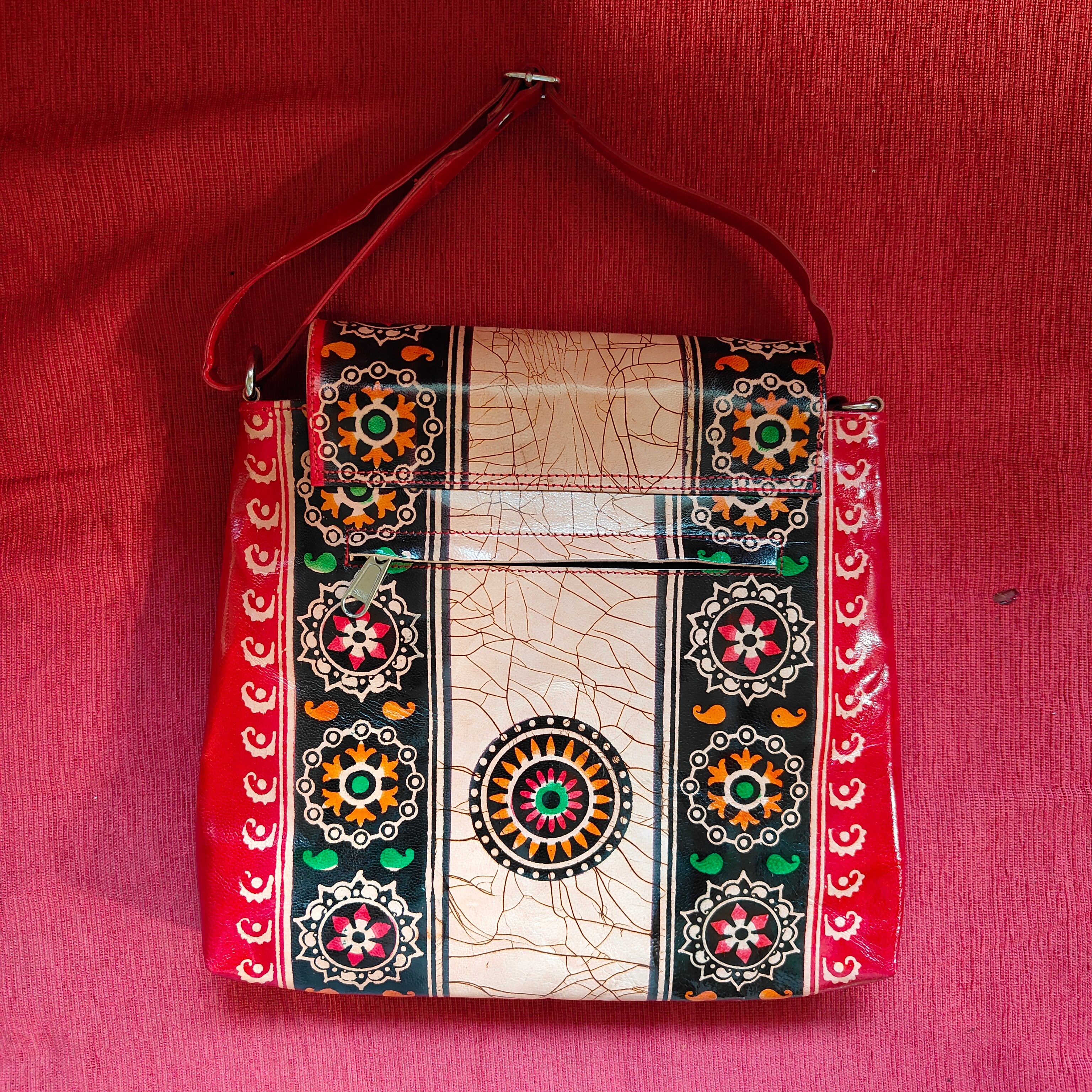 Decorative bag with intricate patterns on a red background