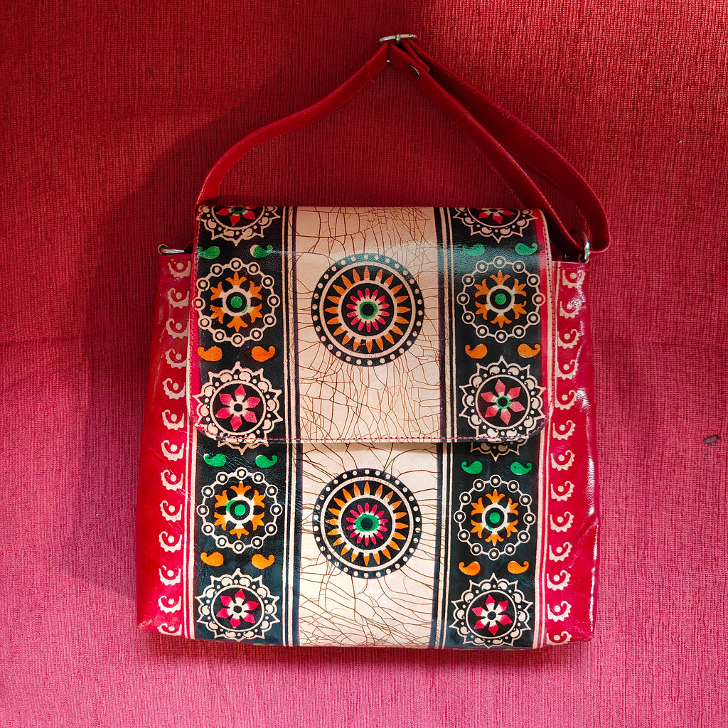 Decorative pouch with intricate patterns on a red background