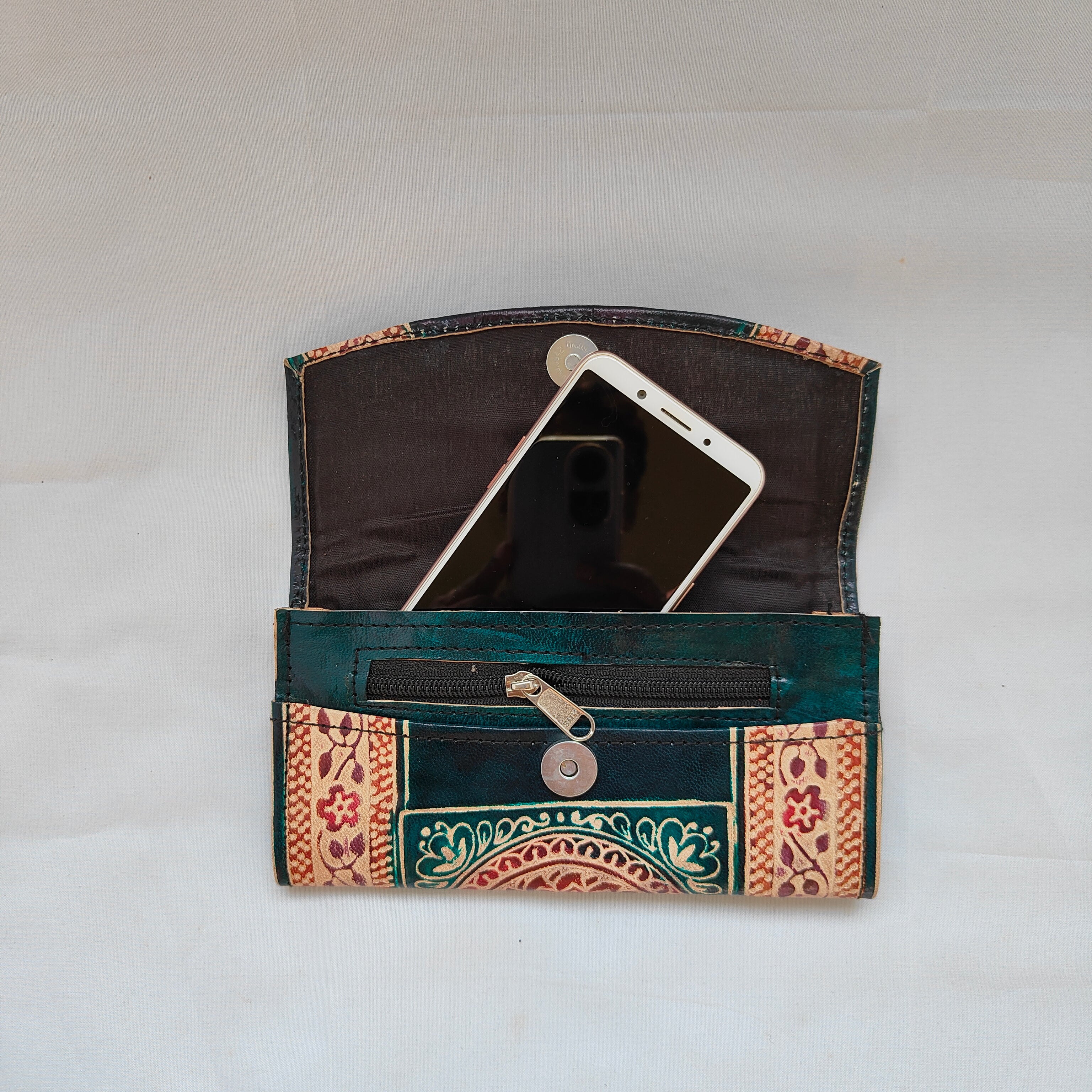 Decorative phone case with intricate patterns on a plain background