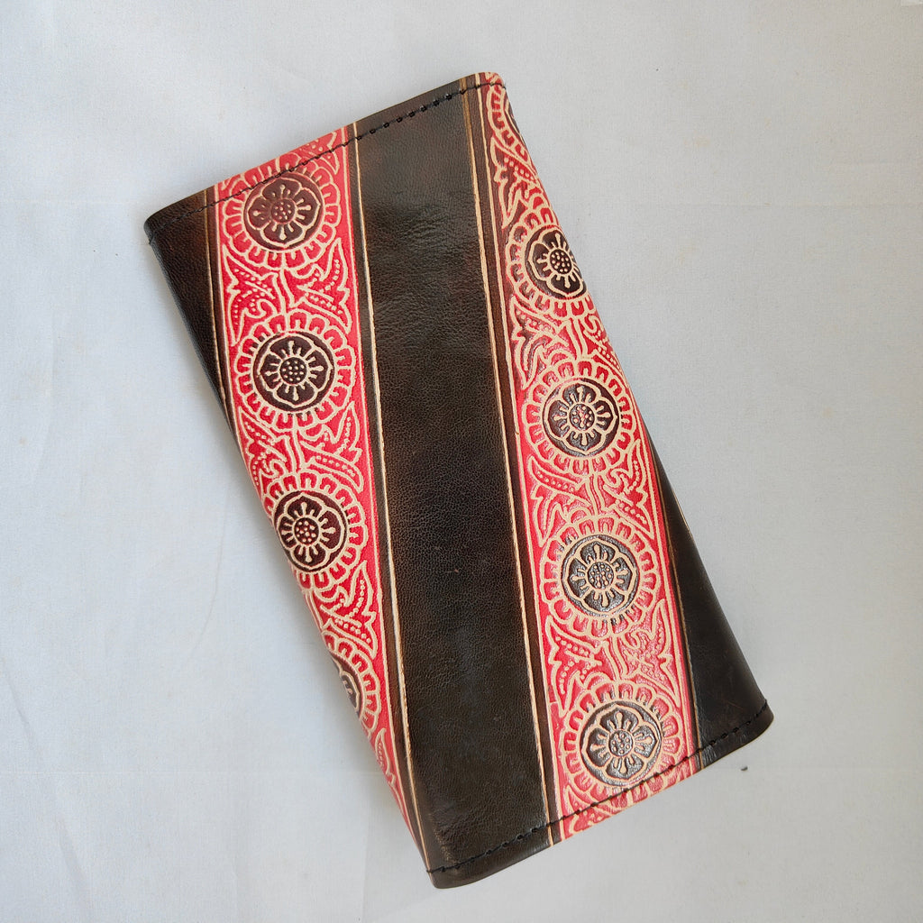 Brown wallet with red and gold pattern on a white background
