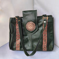 Green leather handbag with decorative straps on a light gray background