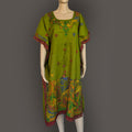 Green dress with colorful embroidery on a mannequin against a gray background