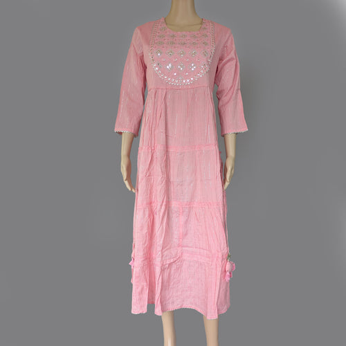 Pink dress with embroidery on a mannequin against a gray background