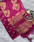 Pink fabric with gold patterns on a white background