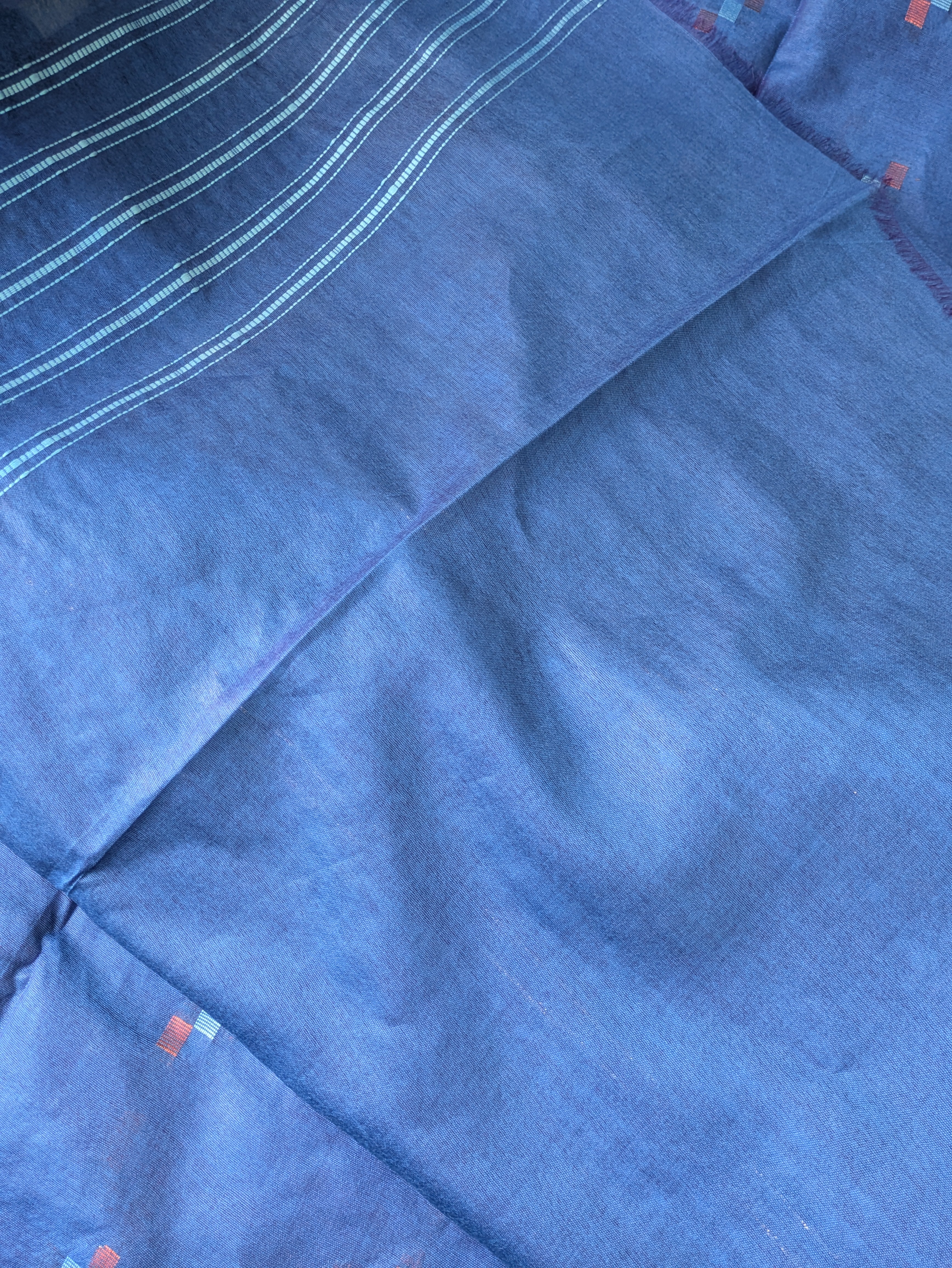 Close-up of blue fabric with a textured pattern
