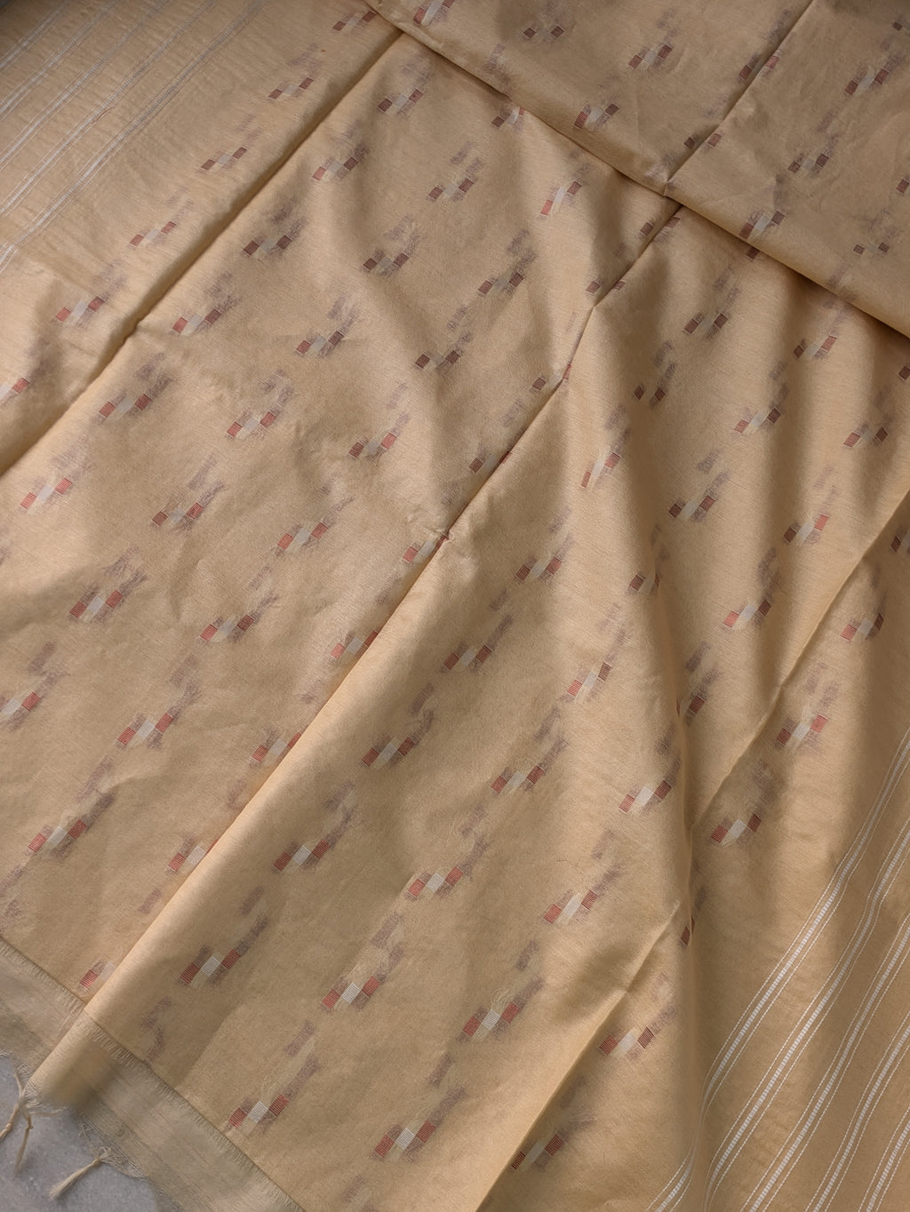 Close-up of beige fabric with subtle pattern
