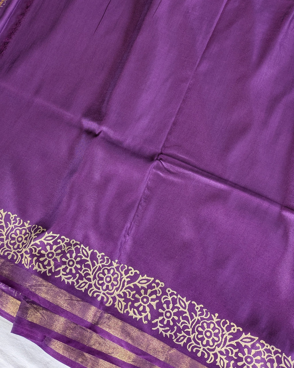 Purple fabric with gold embroidery
