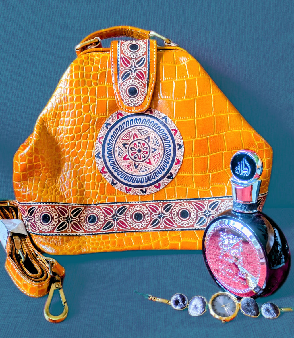 Yellow textured handbag with decorative elements on a blue background, accompanied by a perfume bottle and jewelry.